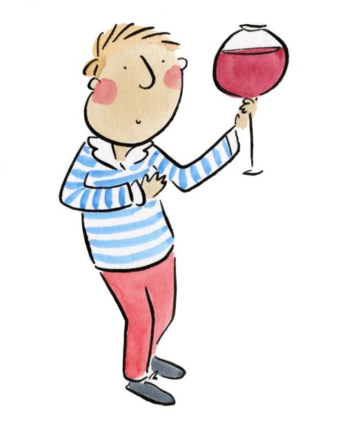 A man holding a giant glass of wine