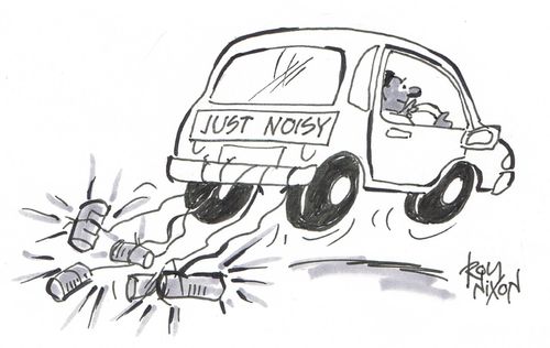 Car driving with cans attached to it and sign reading 'Just Noisy'.