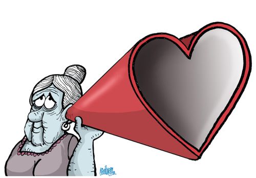 An elderly woman with a heart-shaped ear trumpet