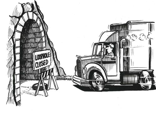 Lorry driver approaching tunnel with blockade reading 'loophole closed'.