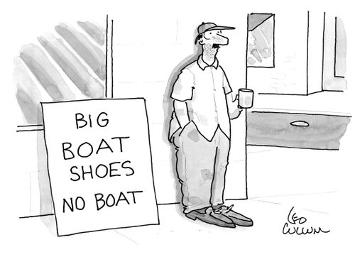 A panhandler with a sign that reads "Big boat shoes no boat".