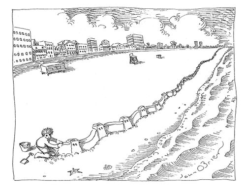 A child builds a really long wall along a beach.
