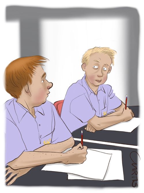 School boys sitting test.
