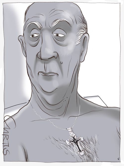 A shirtless old man with a crucifix necklace