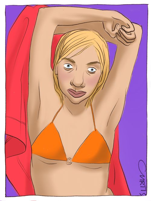 A woman in a bikini dries herself