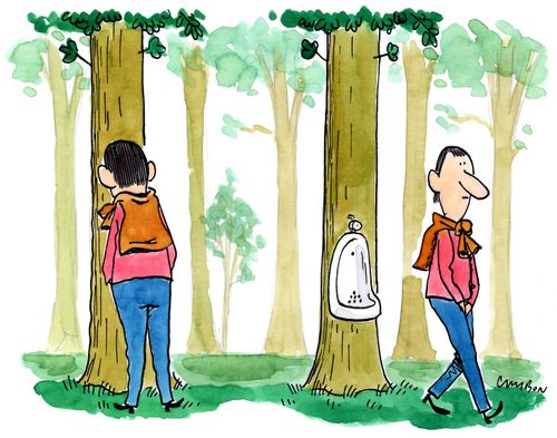 A man uses an outdoor urinal