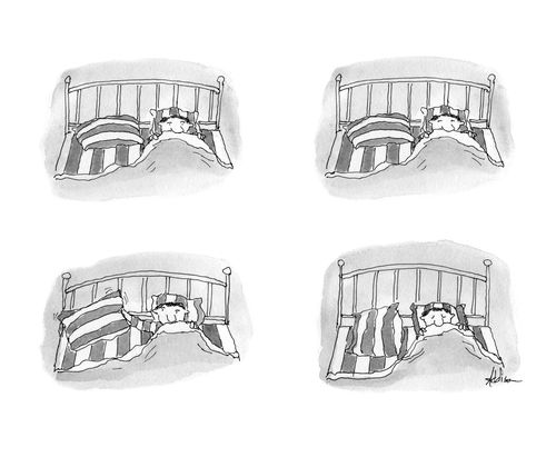 A man adjusts his pillow so the stripes match his bedspread.