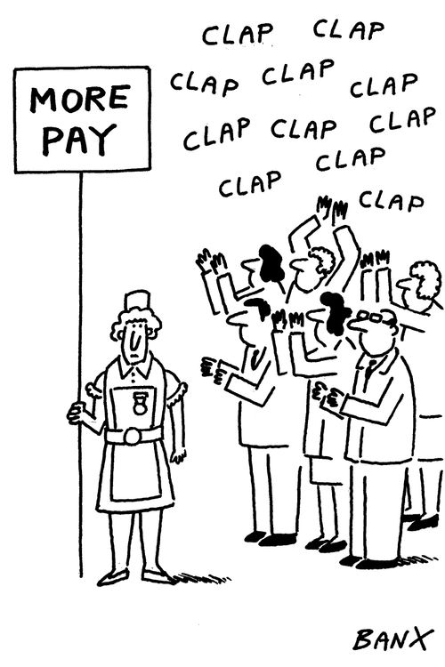 People clap an NHS nurse protesting for more pay.