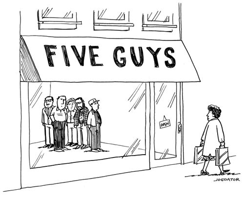 Woman walking past Five Guys.