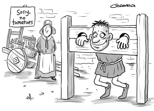 Tomato shortage - Man in pillory is happy about it
