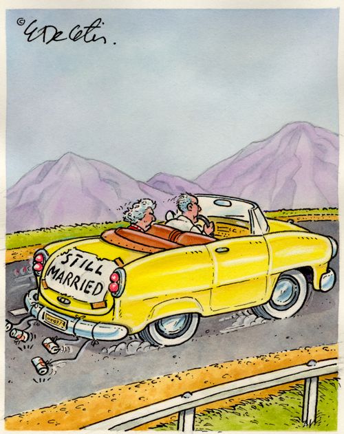 An old man and women are driving along with a 'Still married' sign on their car.
