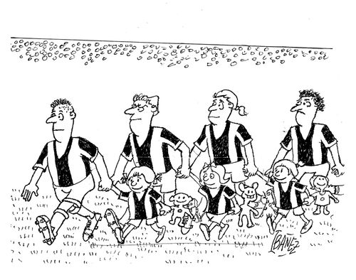 Football players walk onto the pitch holding childrens' hands, who are holding rag dolls. 