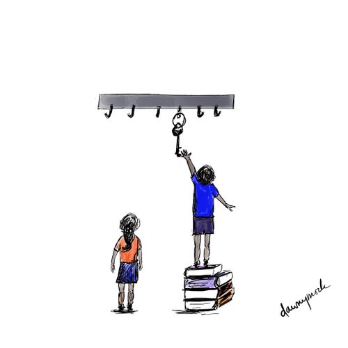 A child climbs on a stack of books to reach a large metal key.