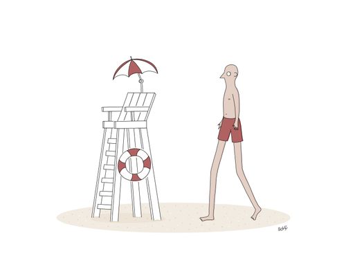 A very tall man walks towards a lifeguard's chair