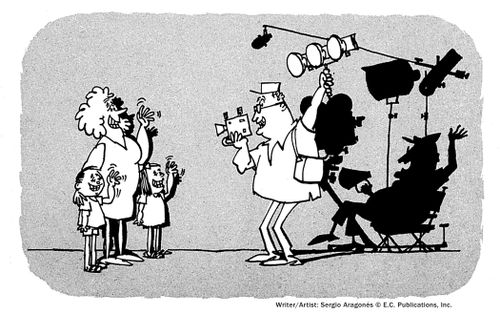 A father films his family while imagining himself as a director