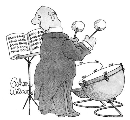 A drummer reads his music.