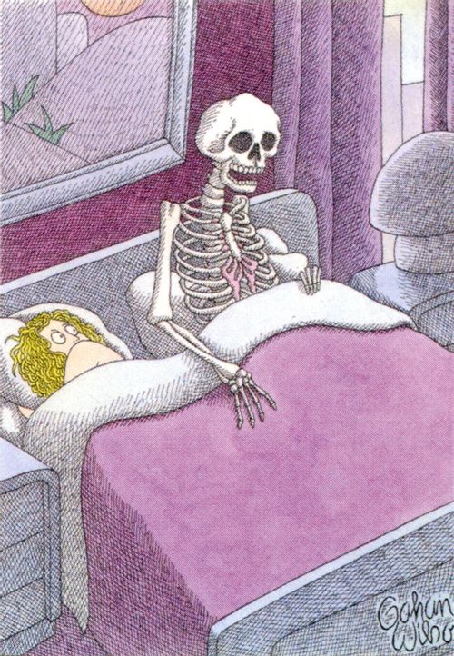 A skeleton sits up in bed.