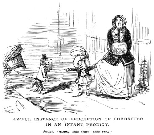 A mother and child looking at a monkey