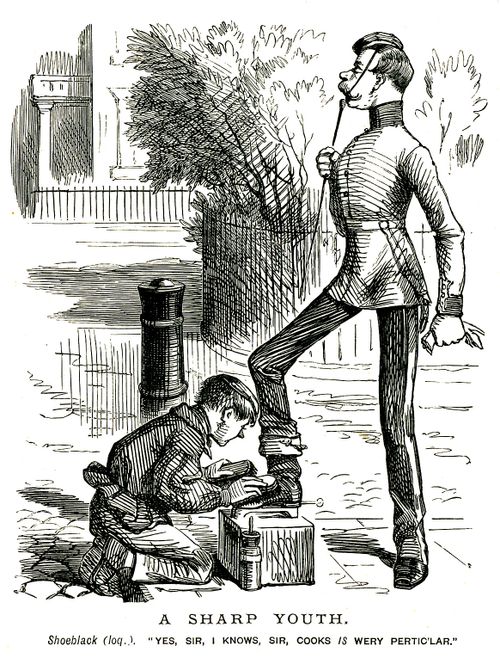 Boy cleaning servant's shoes