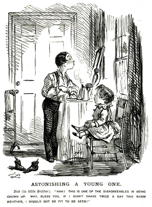 A young boy shaving