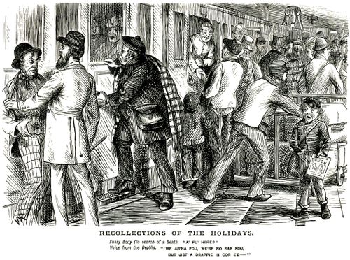 Man trying to find seat on a crowded train