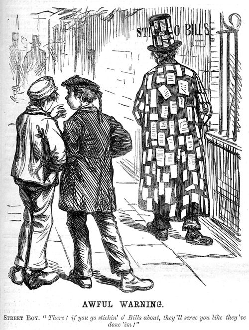 Boys watch a bill sticker