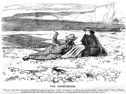 Honeymoon couple on a beach, husband smoking his pipe