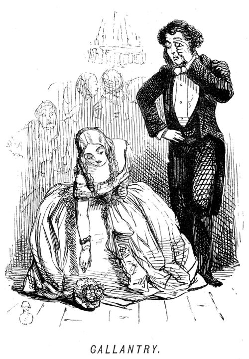 Man watching whilst a woman bends down to pick up flowers