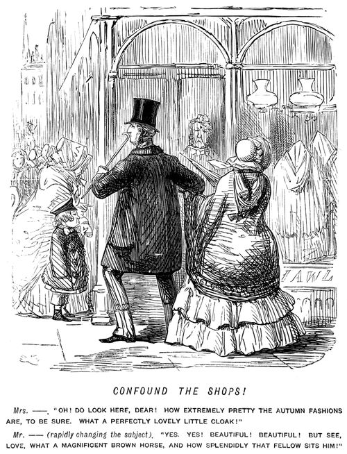 Husband trying to distract his wife from the shop window displays