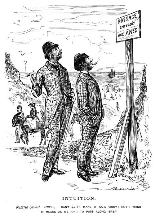 Two tourists inspecting a French sign