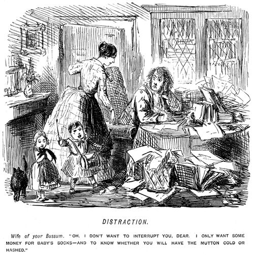 Man is interrupted by his wife and children whilst trying to work