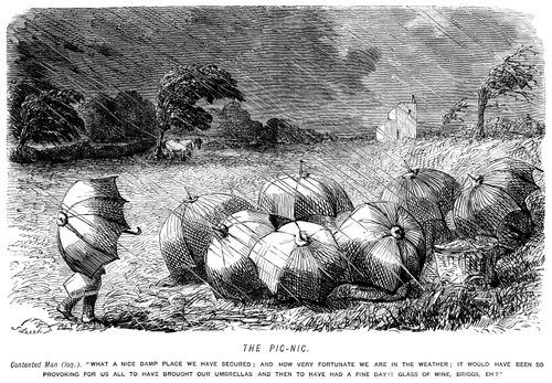Picnickers with umbrellas in heavy rain