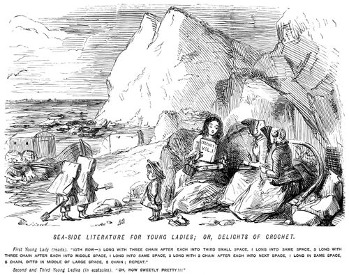 Ladies reading a crochet pattern for amusement